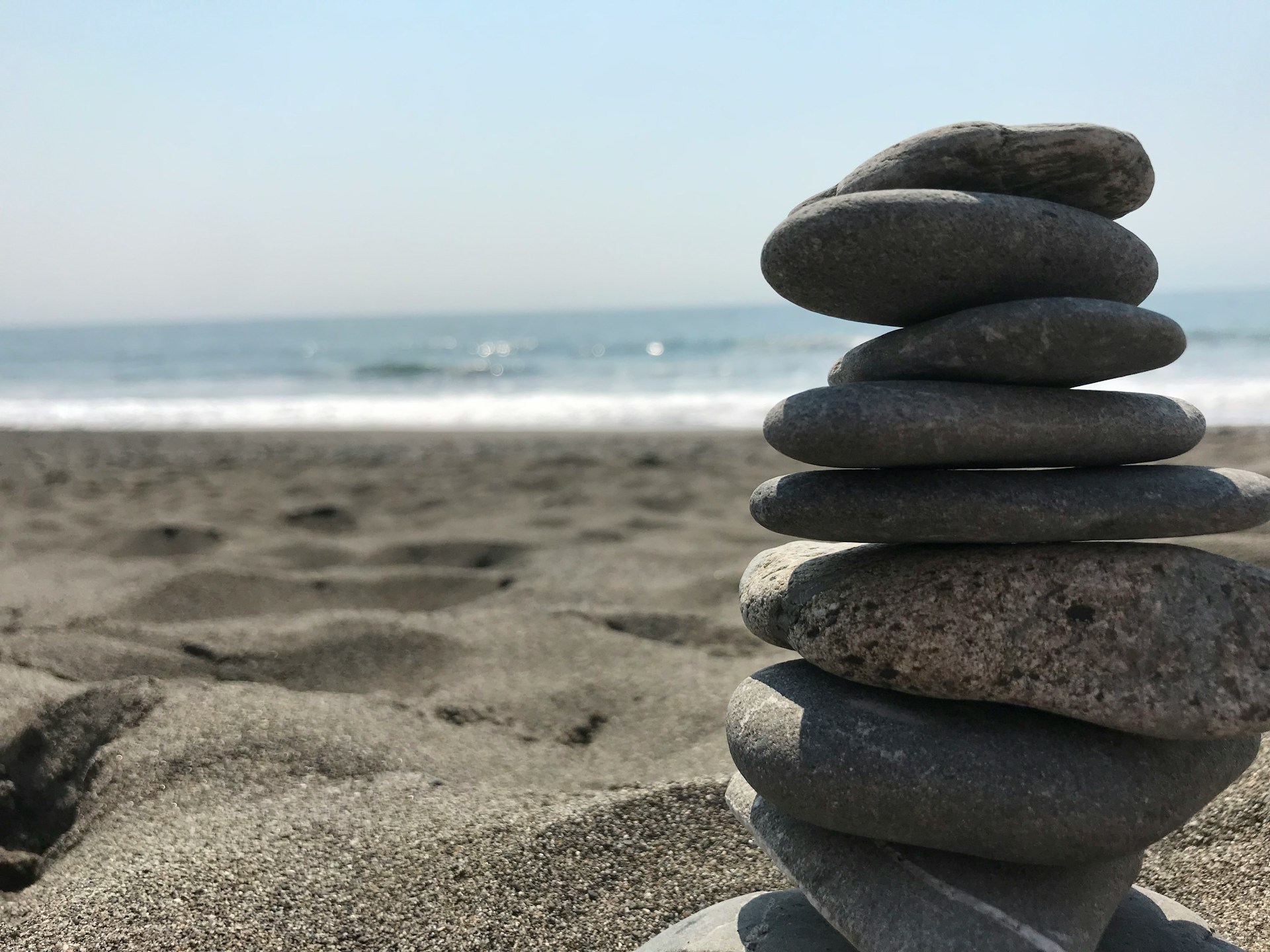Finding Balance in a Busy World Stack of stones on beach during daytime